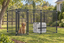 5x10 kennel with a golden dog and white crate outdoors #size_5x10