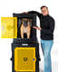 Tom Davis leaning on his signature Dog Crate 'No Bad Dogs' Collapsible Dog Crate